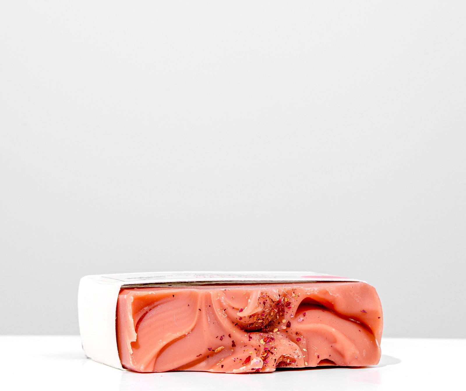 Bar of soap with a label on a white background