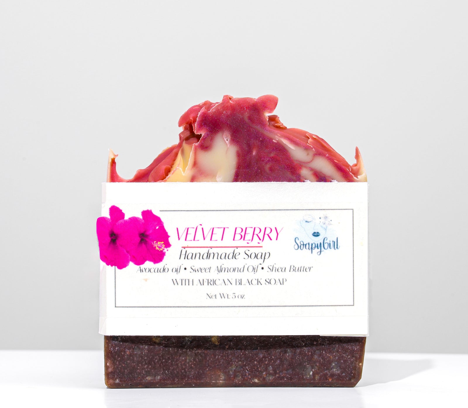 Handmade soap bar with a label on a white background